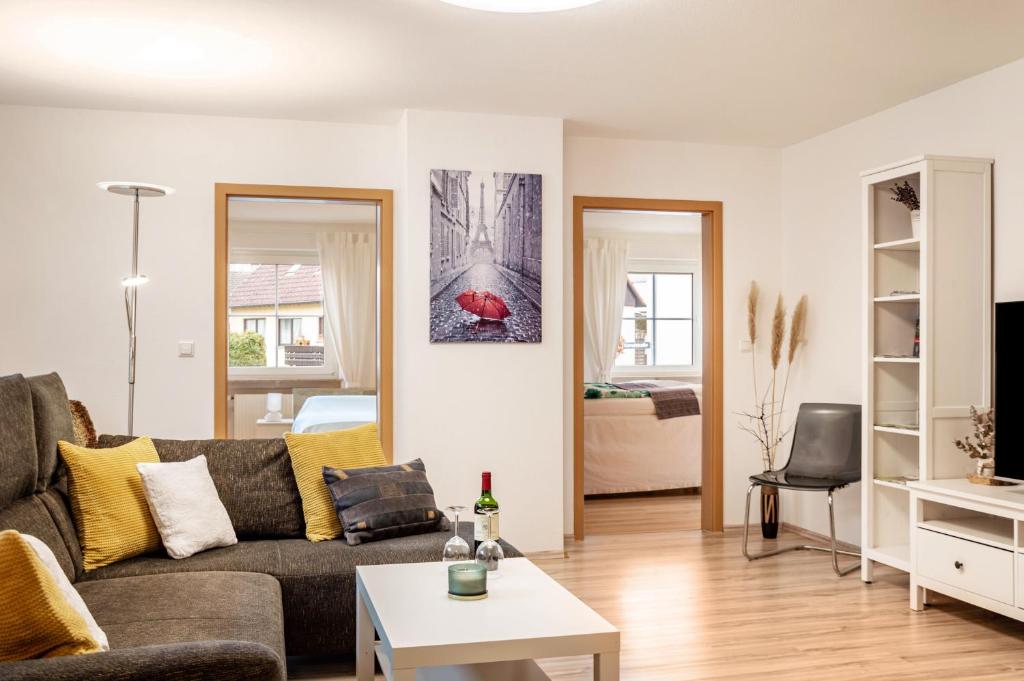 a living room with a couch and a table at Ferienwohnung Weinberg in Markt Einersheim