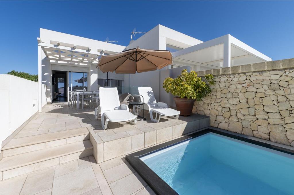 a villa with a swimming pool and a patio at Villa Venza , Salento in Otranto