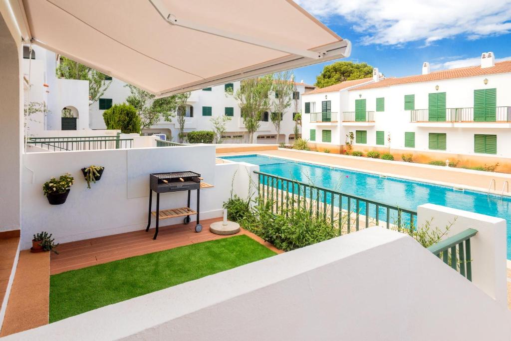 a view of the pool from the balcony of a house at Pregonda 13 Menorca in Son Parc