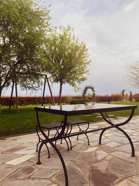 a table sitting on top of a stone patio at Le Zucche Vuote in Quargnento