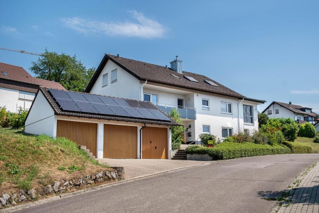 a house with a solar roof on a street at Haus Gramespacher in Bad Bellingen
