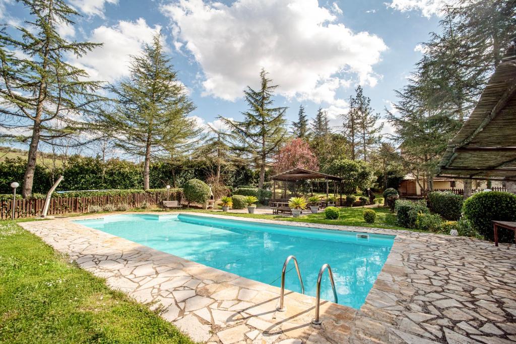 a swimming pool in the yard of a home at Lavanda ad Antico Casale '700 in Umbertide