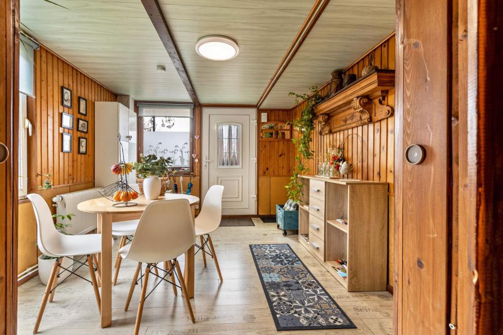 a dining room with a table and chairs at Haus Luise in Stapelburg