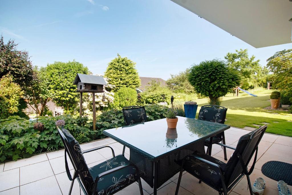a table and chairs sitting on a patio at Easy Living in Tettnang