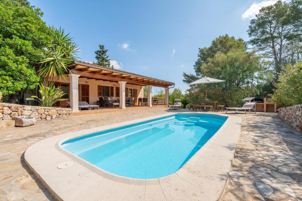 an image of a swimming pool in front of a house at Finca Biniali in Sencelles