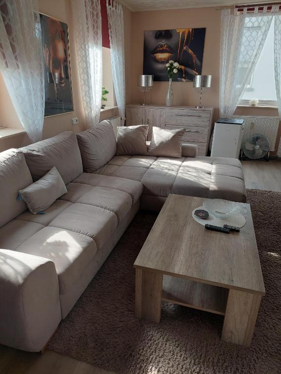 a living room with a couch and a coffee table at Tapas restaurante 1 in Viersen