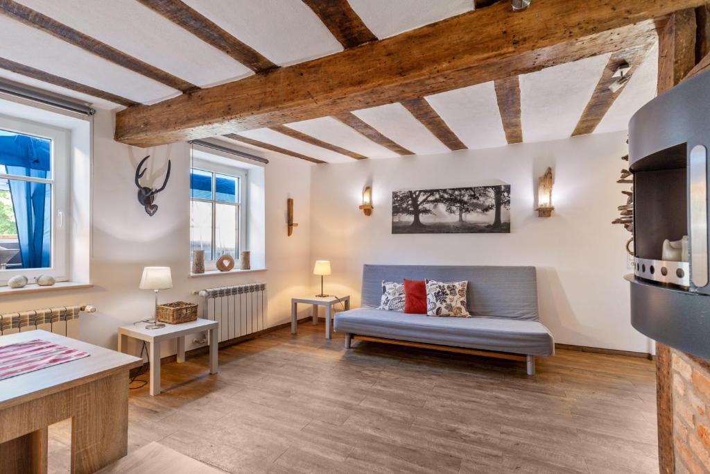 a living room with a couch and a table at Wohnung 1 in Wallhausen