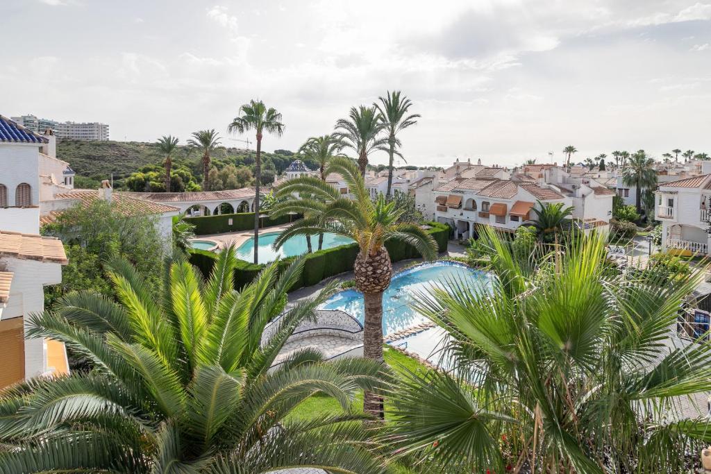 an aerial view of a resort with palm trees at Casa Pedro Piscina in Puerto Marino
