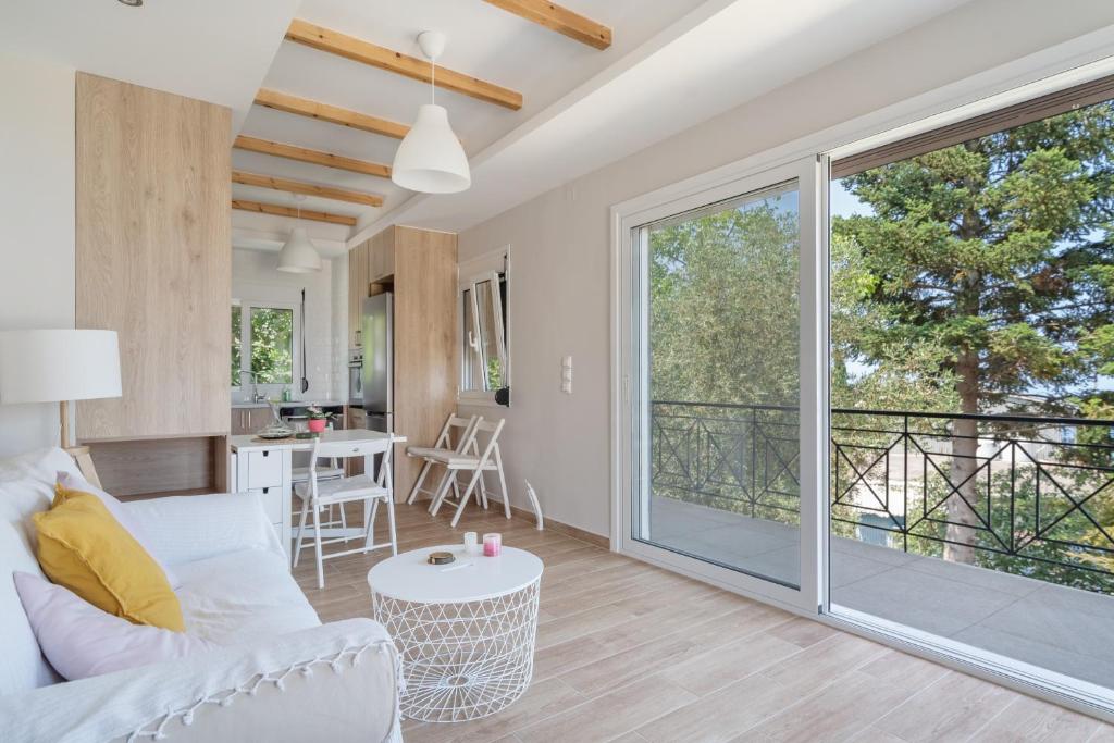 a living room with a large sliding glass door at Ionian Home in Exanthia