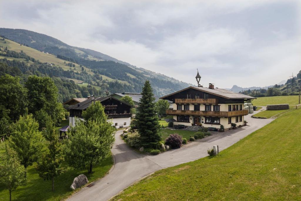 an aerial view of a house in the mountains at Wolfbachgut - Ferienwohnung 5 in Taxenbach