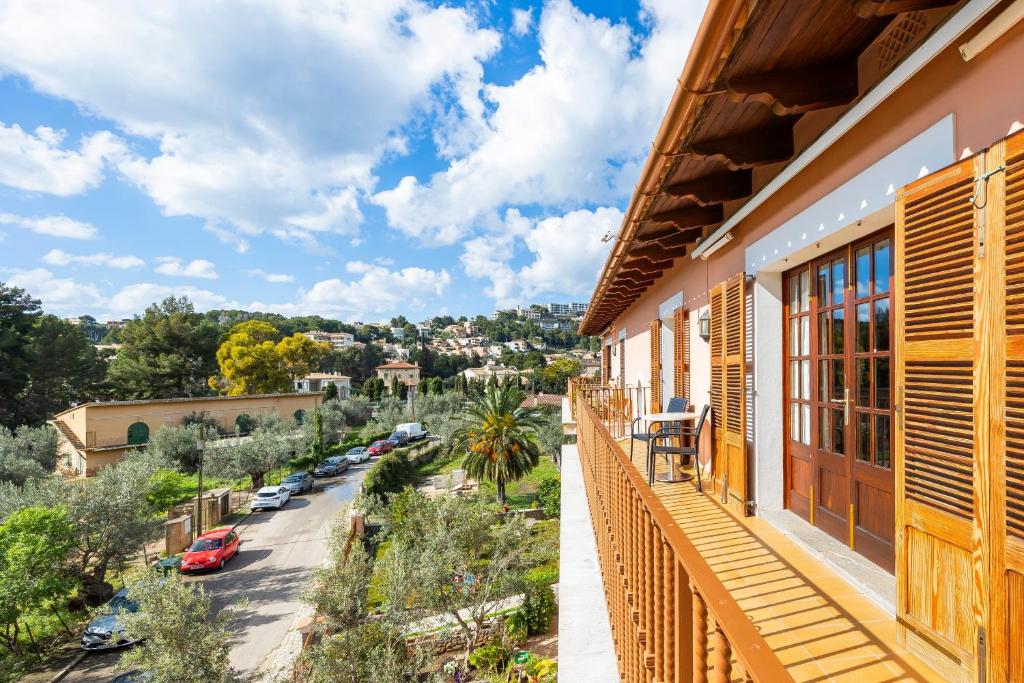 a balcony of a house with a view of a street at Can Navarro in Port de Soller