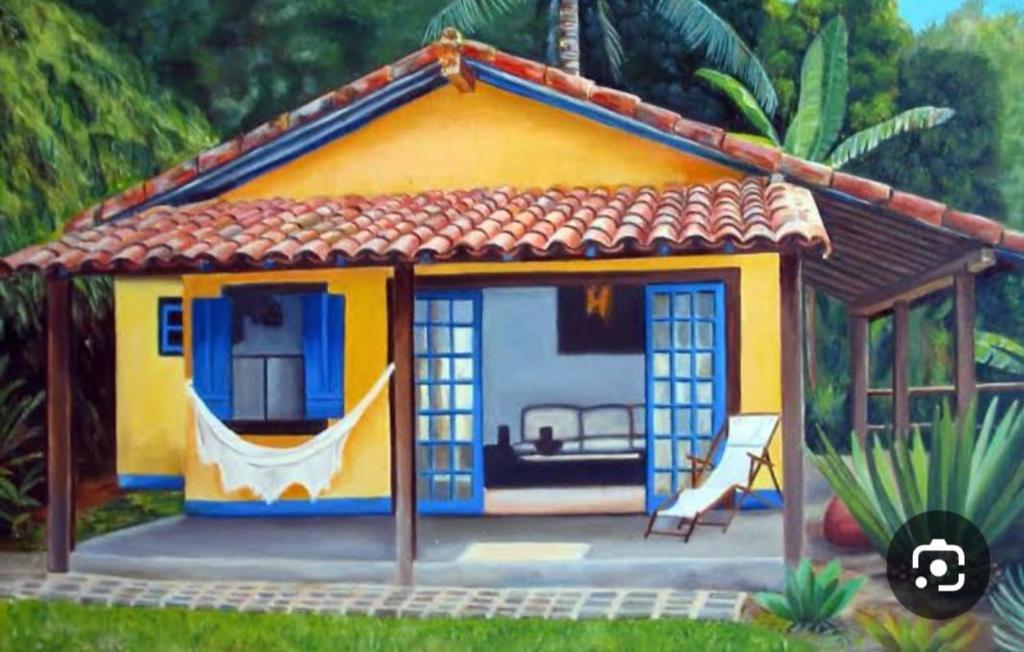 a model of a house with a hammock in it at Espaço LIMÃO CRAVO in Sapucaí-Mirim