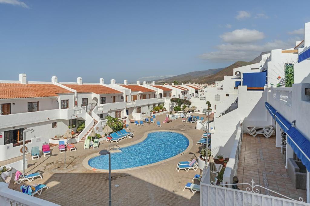 arial view of a resort with a swimming pool at Charming one bedroom Los Cristianos in Arona