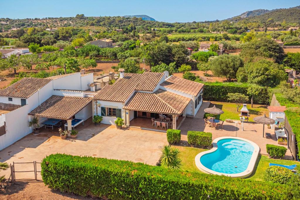 an aerial view of a house with a swimming pool at Finca Boy in Pollença