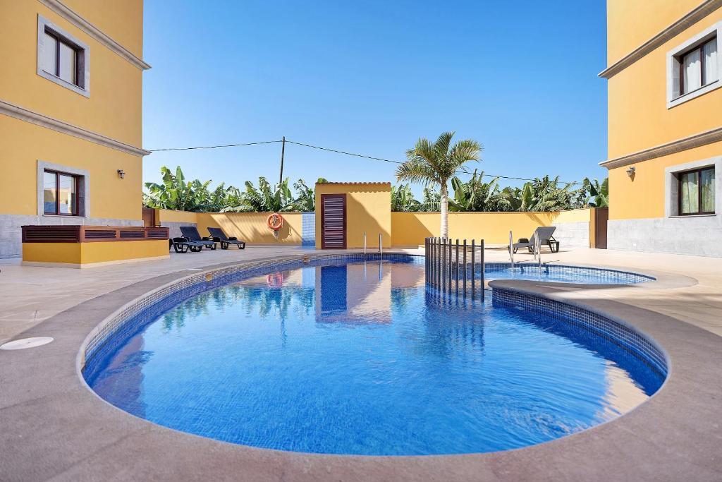 a swimming pool in the middle of a building at Cozy Tazacorte in Tazacorte