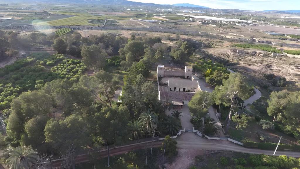an aerial view of a house in a forest at El Limonar in Murcia