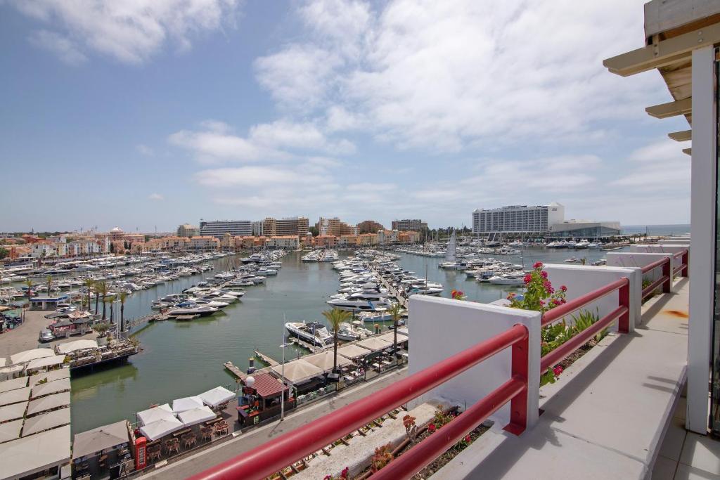 a view of a marina with boats in the water at Marina Vilamoura Penthouse Luxury in Vilamoura