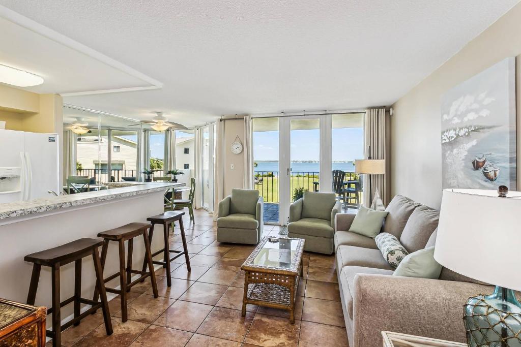 a living room with a couch and a bar at Santa Rosa Dunes 923 in Pensacola Beach