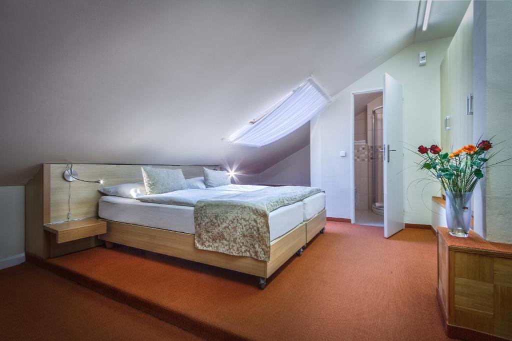 Postel nebo postele na pokoji v ubytování Hotel Taurus