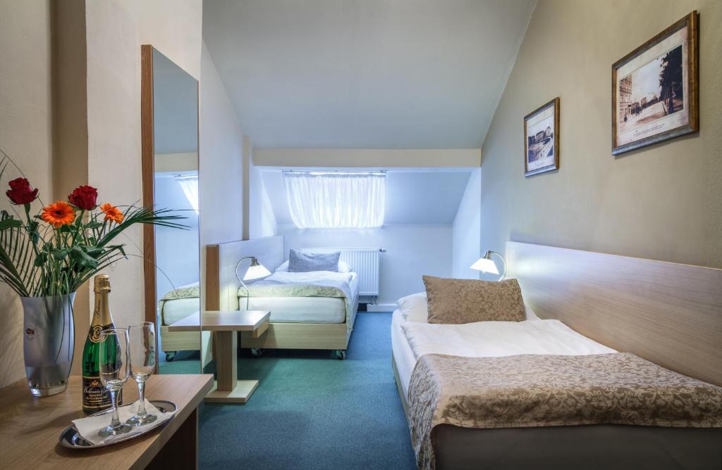 Postel nebo postele na pokoji v ubytování Hotel Taurus