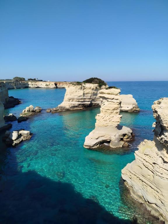 an aerial view of the rocky islands in the ocean at Briamar Residence in Torre dell'Orso