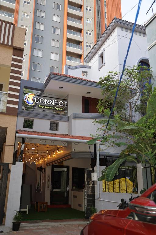 a building with a sign that reads comforterct at Connect Backpackers Hostel in Chennai