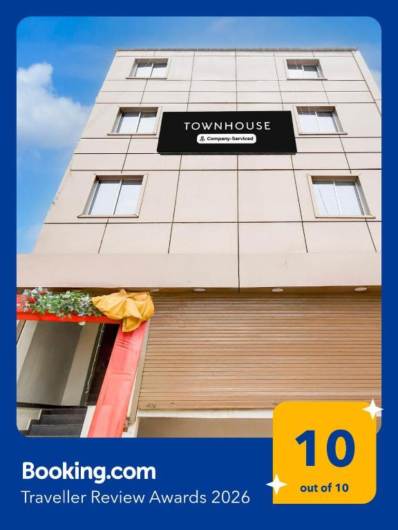 a building with a sign on the side of it at OYO Townhouse Civil Lines Prayagraj Formerly Raj Mahal Palace in Civil Lines