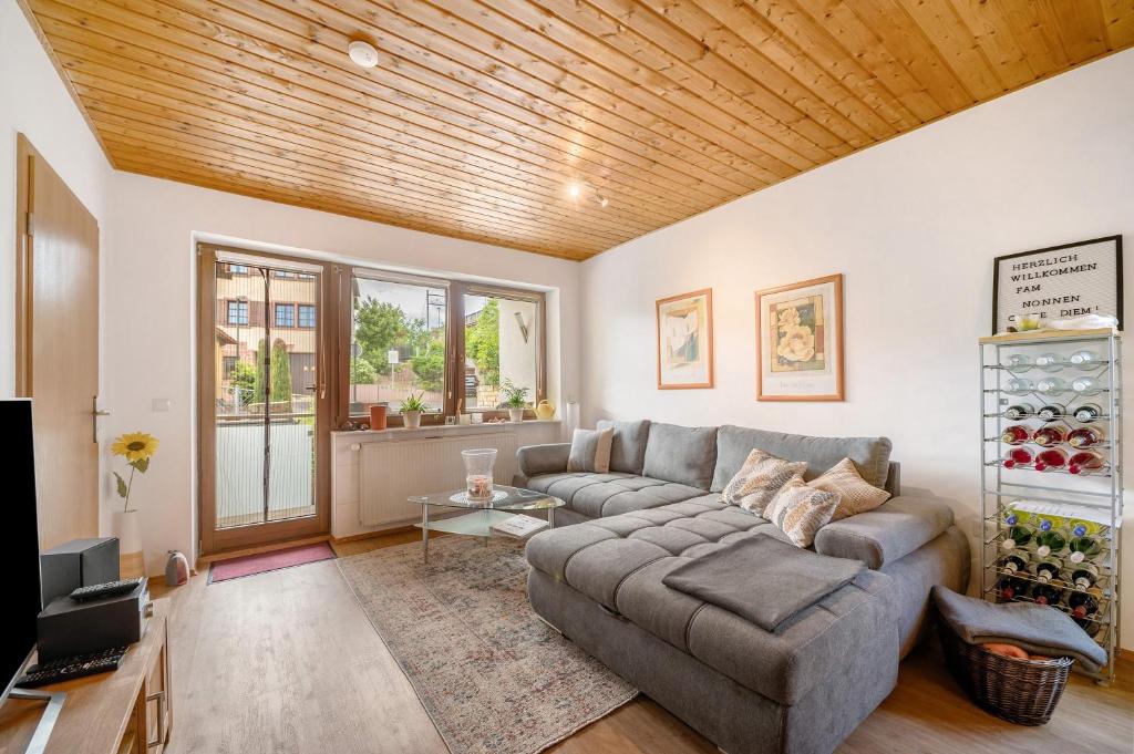 a living room with a couch and a tv at Casa Mia in Bad Dürkheim