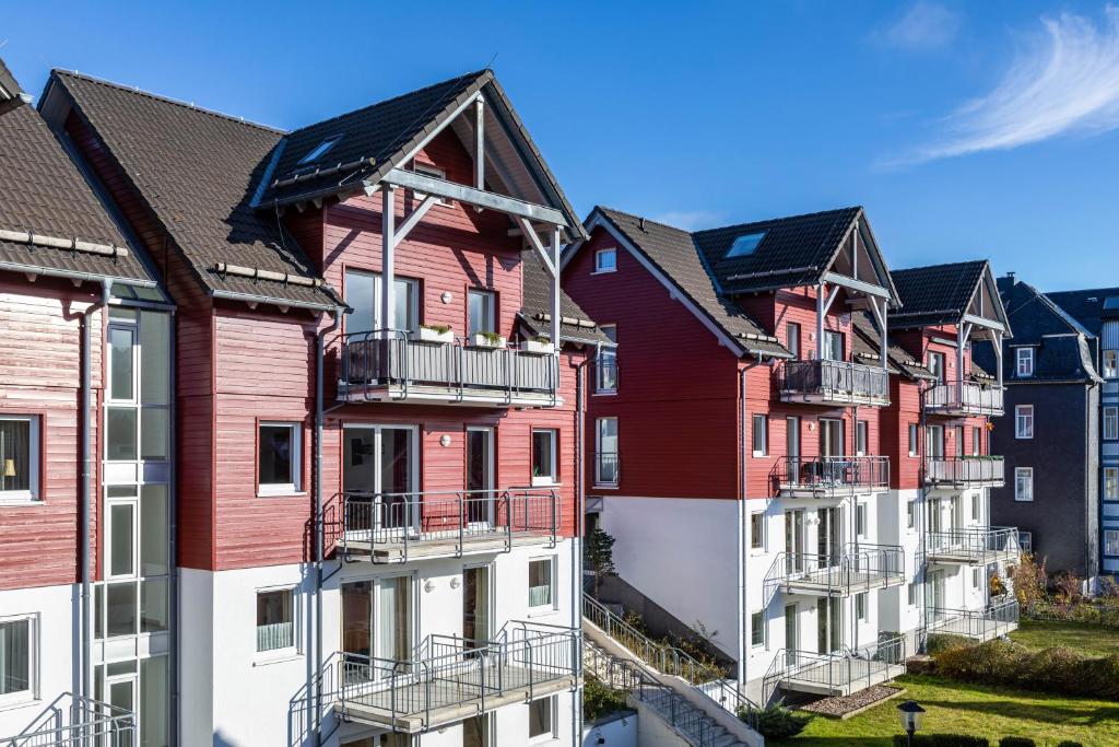 a row of colorful houses in a row at Ferienwohnung Tannenblick 2-1 in Oberhof