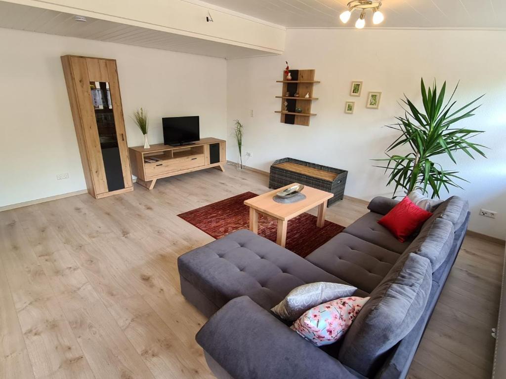 a living room with a couch and a table at Hegauliebe in Tengen