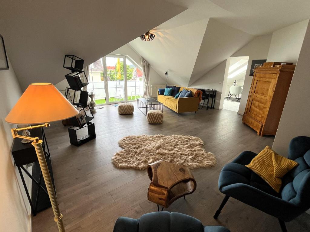 a living room with a couch and a rug at Ferienwohnung an der Aschaffaue in Aschaffenburg
