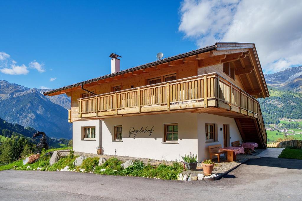 a house with a balcony on the side of it at Gögelehof in San Martino