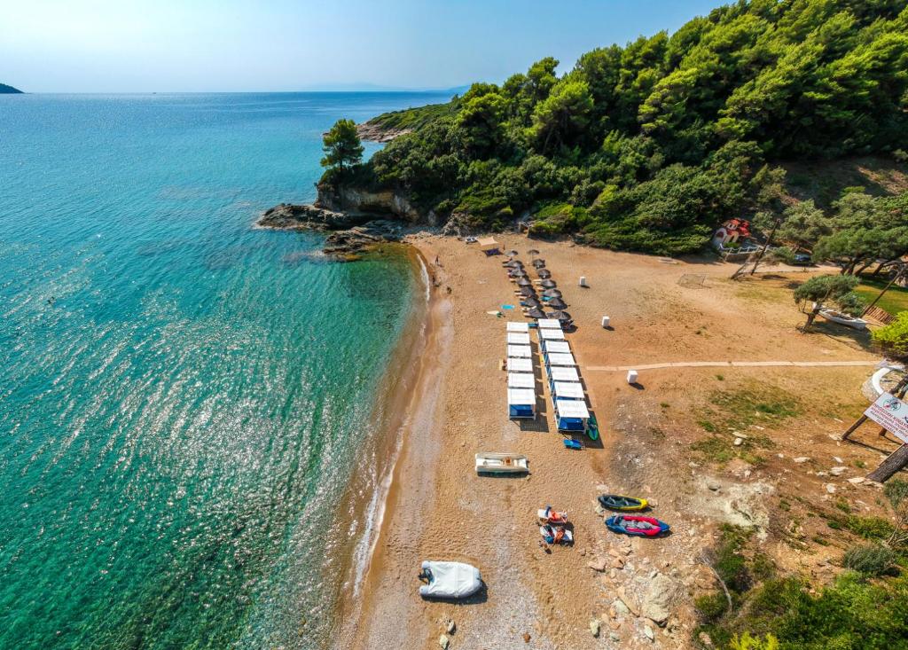 an overhead view of a beach with a group of boats at Menagia Village in Agios Georgios