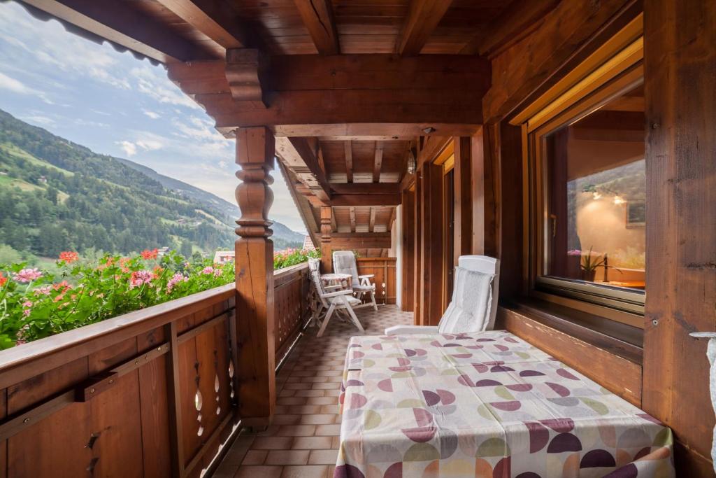a room with a bed on a balcony with a view at Sonnenparadies Apartement 4 in Saltusio