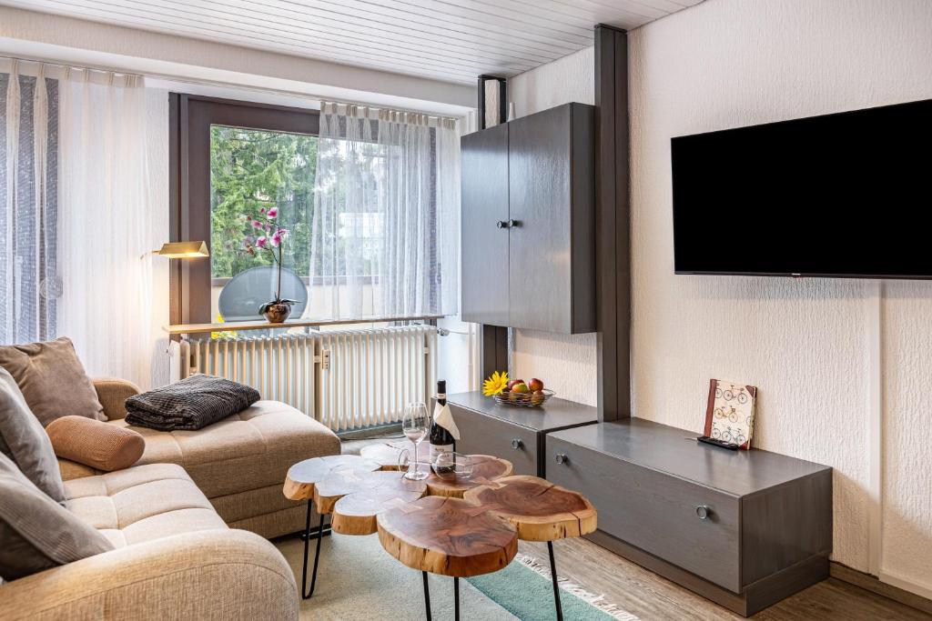 a living room with a couch and a table at Fewo Luzia in Schönwald
