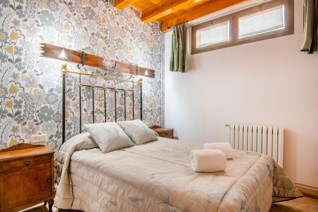a bedroom with a large bed in a room at Casa Batlle Boix in Les Iglésies