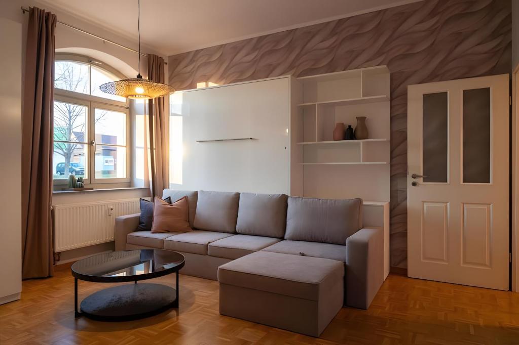 a living room with a couch and a table at Ferienwohnung Lindner 2 in Weimar