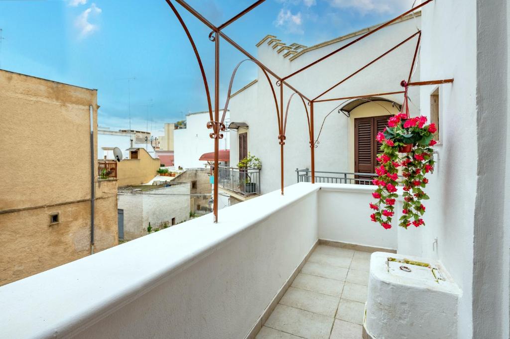 a balcony with a view of a building at Sg Apartment Standard in Massafra