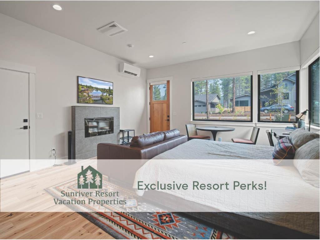 a bedroom with a bed and a living room at 18129-2 Forestbrook Loop in Bend