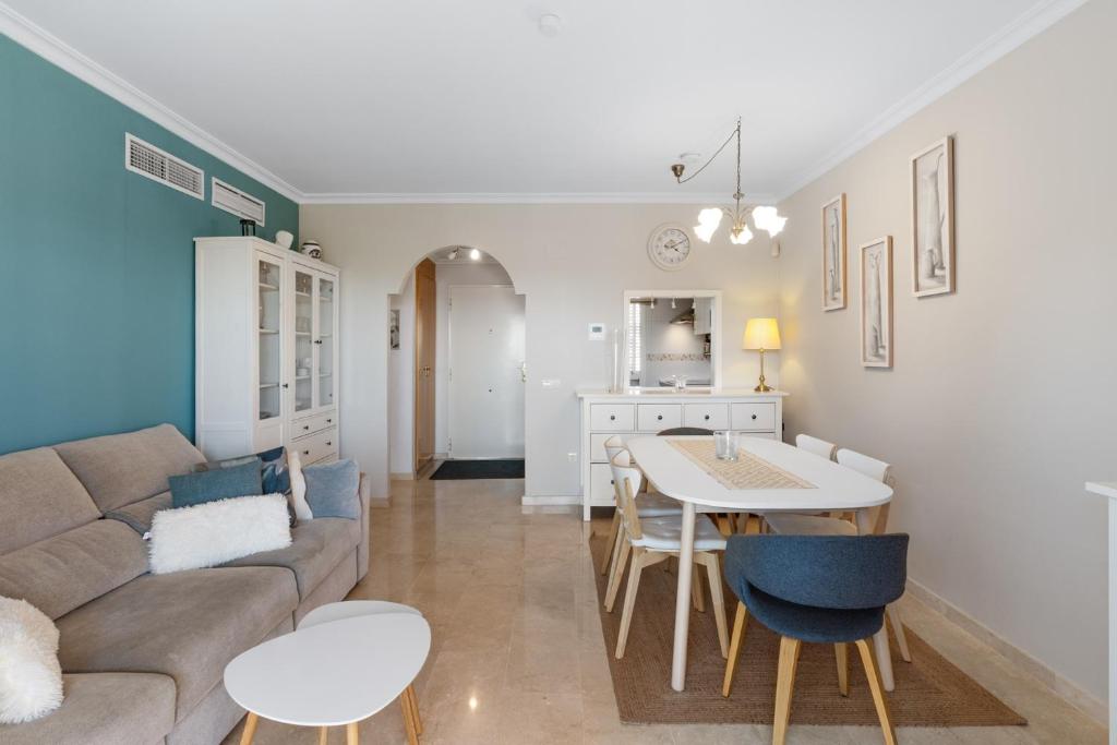 a living room with a couch and a table at Topacio A114 in Mijas Costa