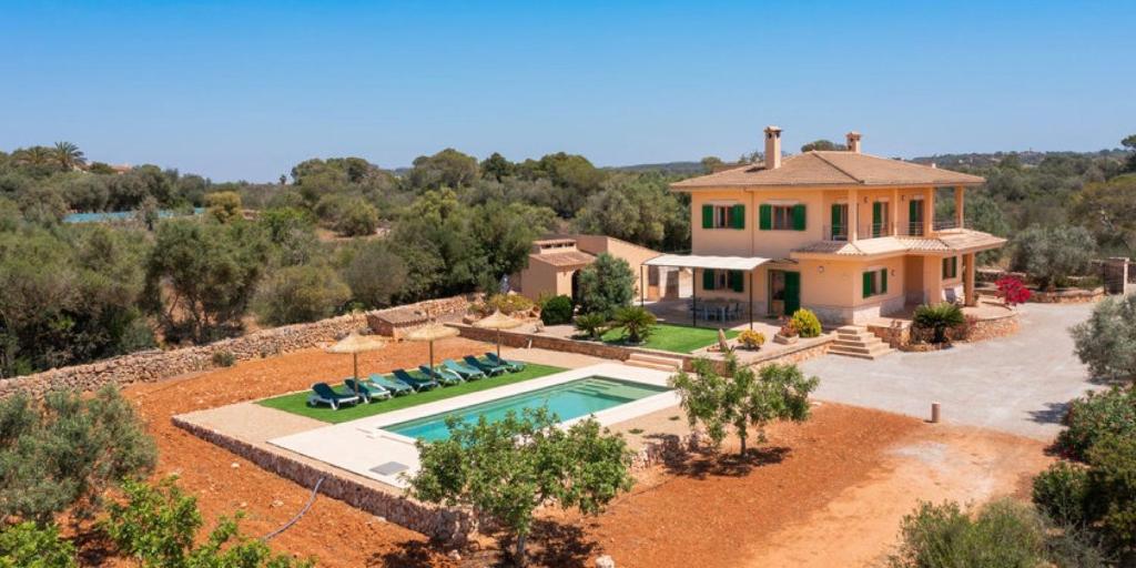 an aerial view of a house with a swimming pool at Villa Hort de Can Rafalet in Ses Salines