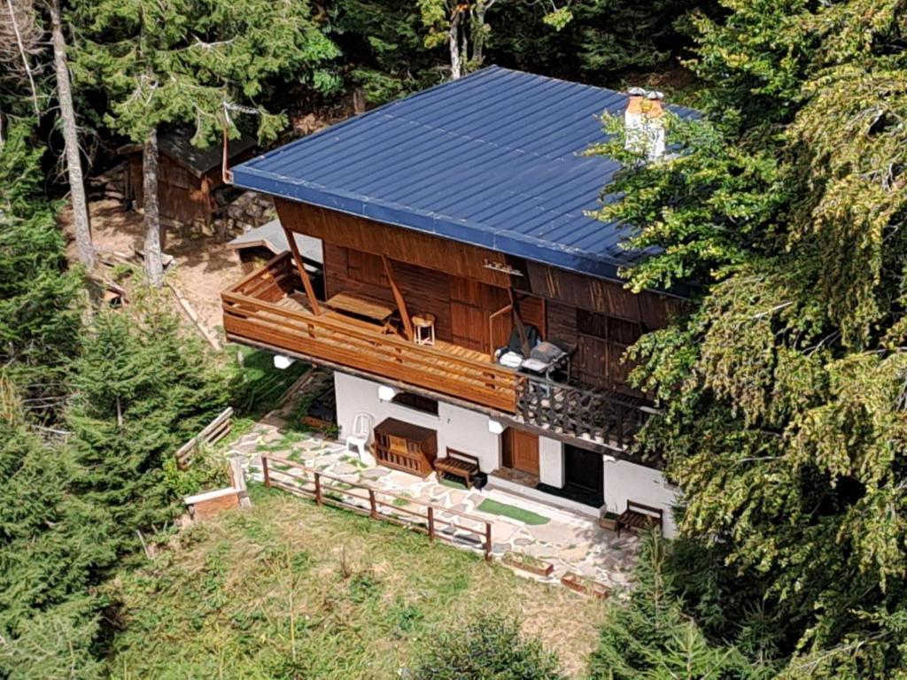 an aerial view of a house with a blue roof at Chalet Vététiste in Laveissière