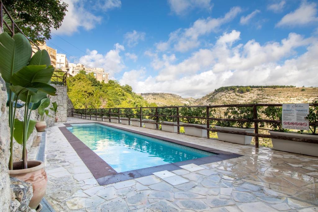 a swimming pool on top of a building at Chibao House con piscina privata in Ragusa
