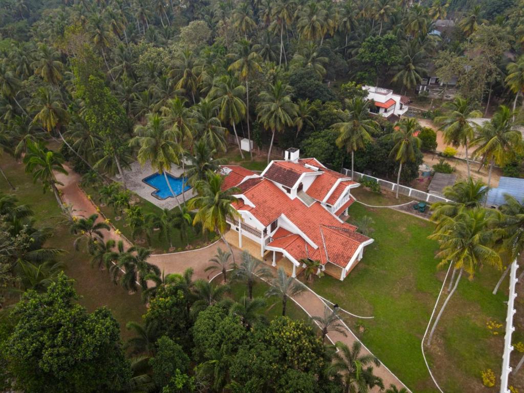 an aerial view of a house with palm trees at Villa Di Angelo Negombo in Negombo
