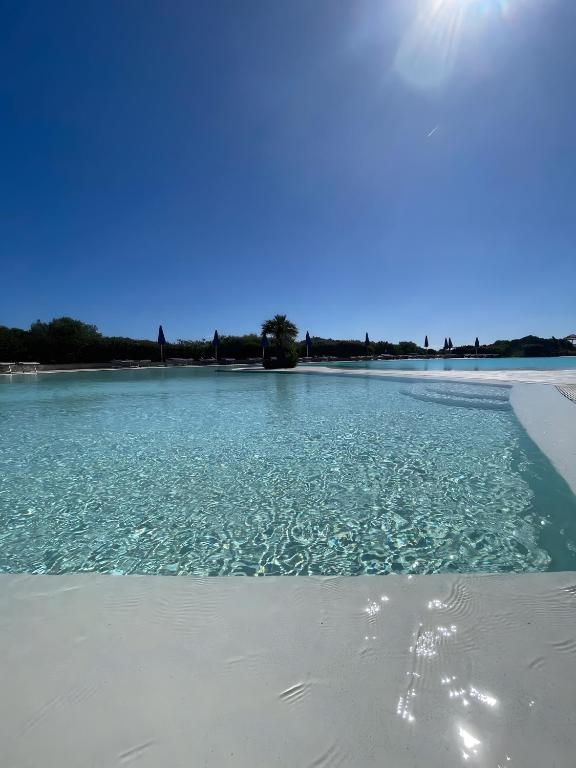 a view of the water on a beach at Monolocale Sergi- Piscina In Comune in Stintino