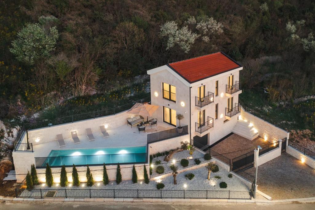 an aerial view of a house with a swimming pool at Boutique Villa Levante in Blizikuće