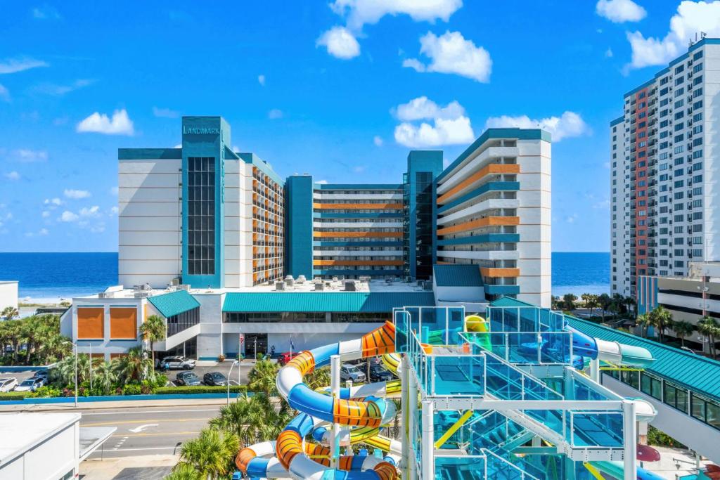 a water slide in front of a city at Landmark Resort Ocean View Beach Pools Villa in Myrtle Beach