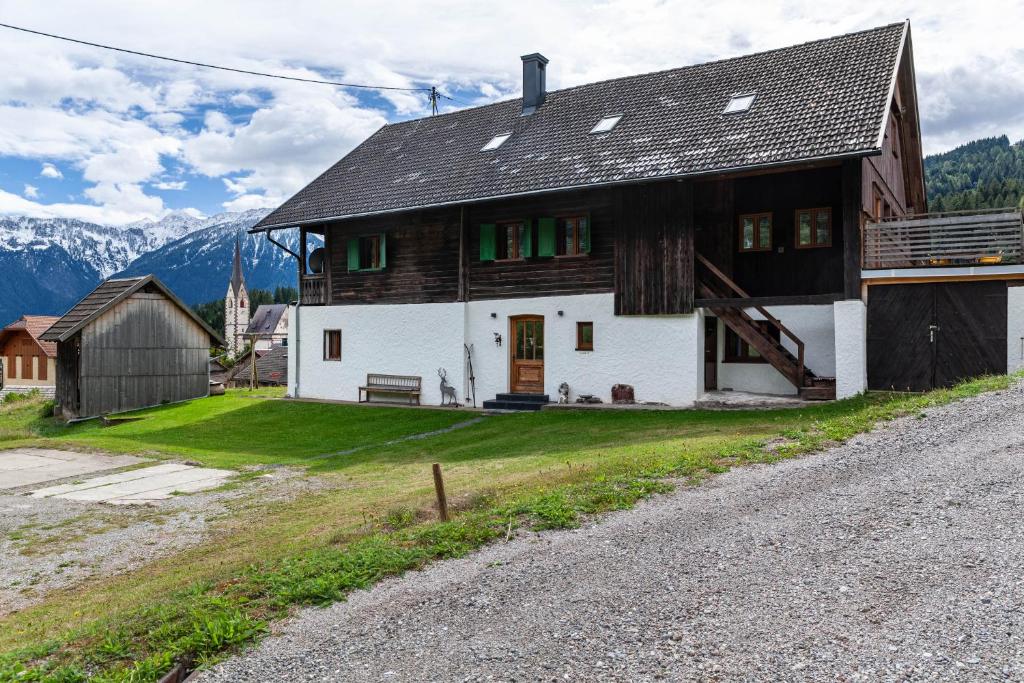 a house on the side of a road at Penthouse im Bauernhaus in Kötschach