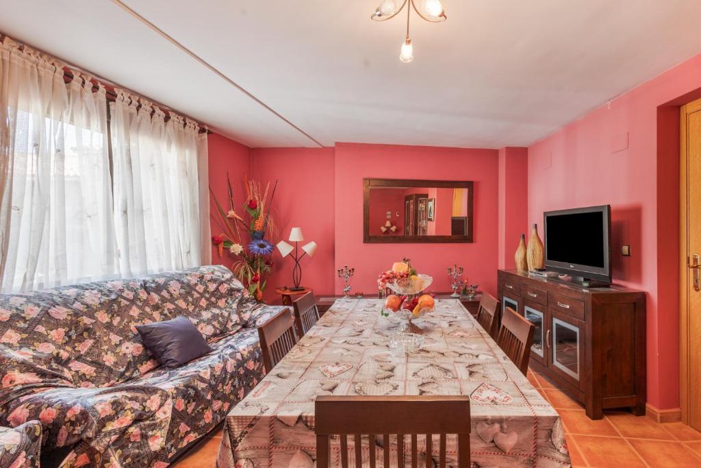 a living room with a couch and a table at El Rellano in Maluenda