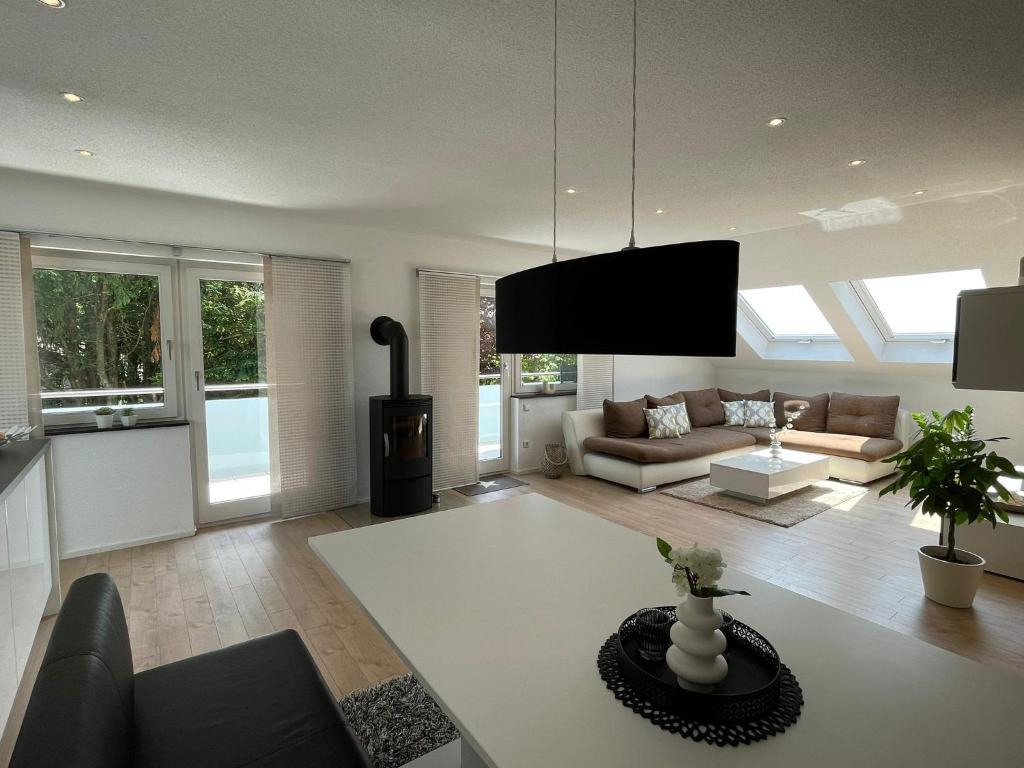 a living room with a couch and a table at Hegaublick in Stockach